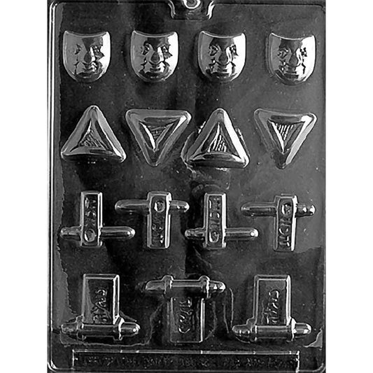 Clear plastic chocolate mold with assorted Purim shapes, including four small mask face cavities, four triangular hamantaschen cavities with textured centers, and multiple mini gragger noisemaker cavities with side handles.