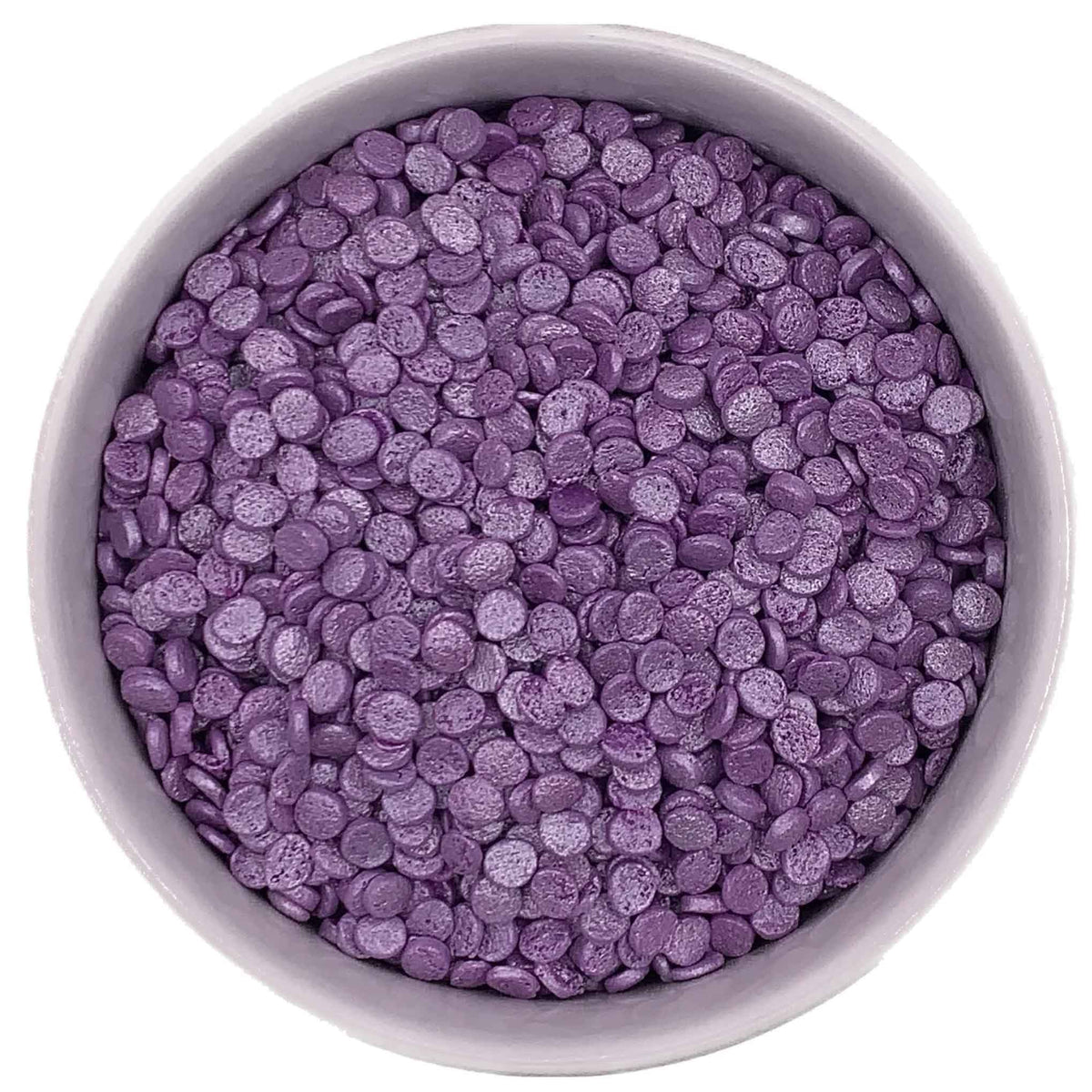 White bowl filled with small, flat, round Purple Pearlized Confetti Quinn Sprinkles showing their pearly finish