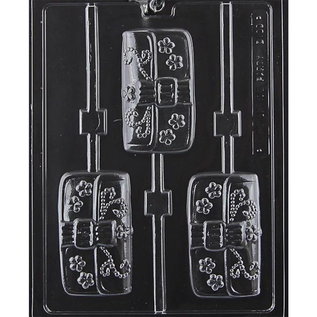 Clear plastic purse chocolate lollipop mold with three handbag-shaped cavities featuring bow, buckle, and floral details.