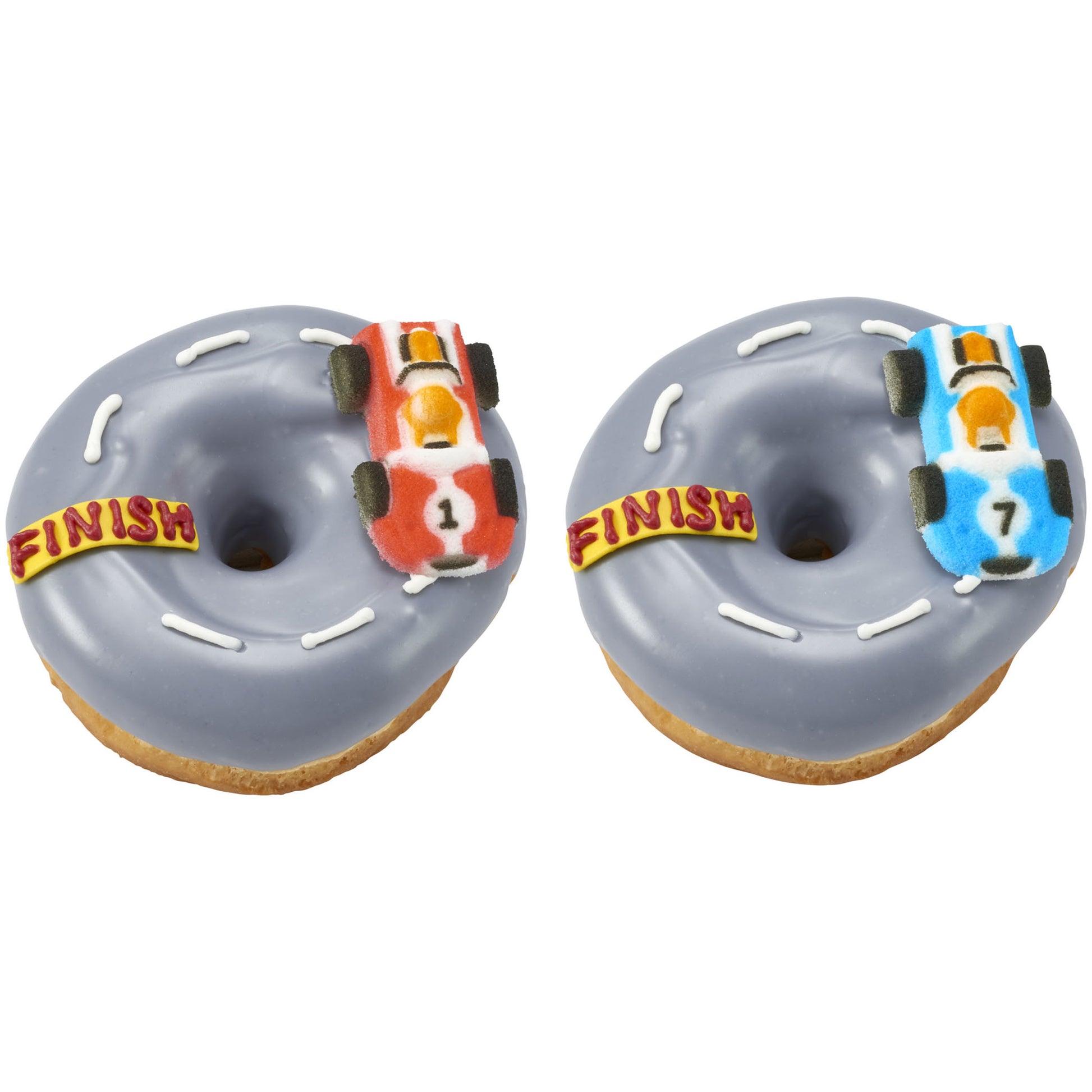 Two gray-glazed donuts decorated like racetracks with white icing lane marks and a yellow finish banner, each topped with a red or blue pressed sugar race car.