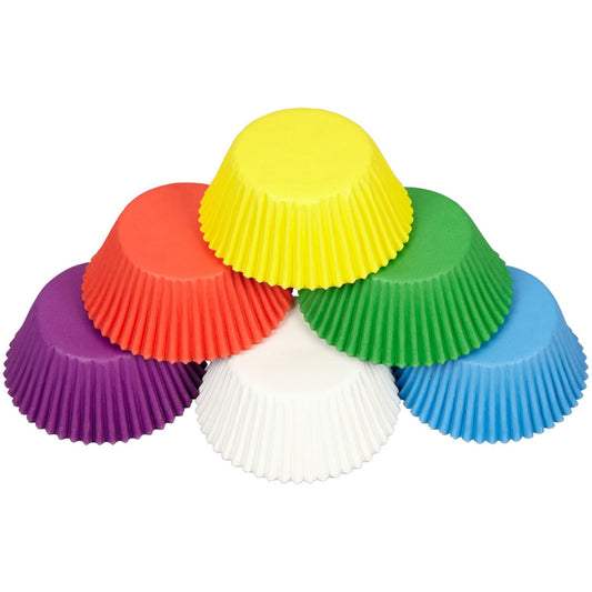 Upside-down view of rainbow cupcake liners arranged in a semi-circle to show color variety.