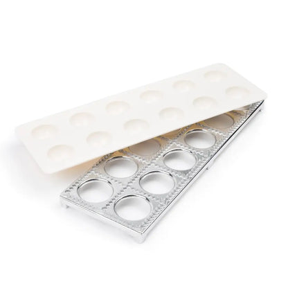 Ravioli maker set with white plastic press and aluminum cutting frame with round openings