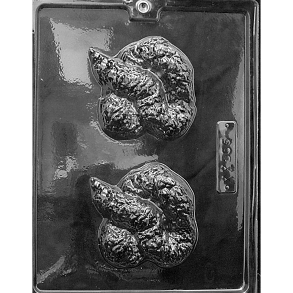 Clear Pile of Poop Chocolate Mold photographed against a black background, featuring two large cavities shaped like coiled, heavily textured piles of poop.