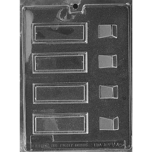 Clear plastic chocolate mold with four long rectangular plaque cavities with a raised border, plus four small stand-shaped cavities on the side; shown on a dark background.