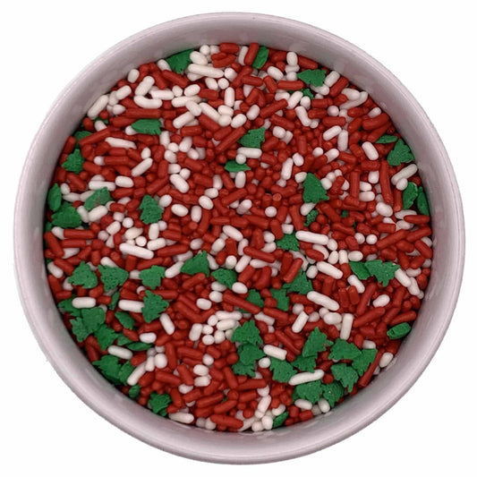 Holiday sprinkle mix featuring red and white jimmies with green Christmas tree shapes, in a 3.2 oz container.