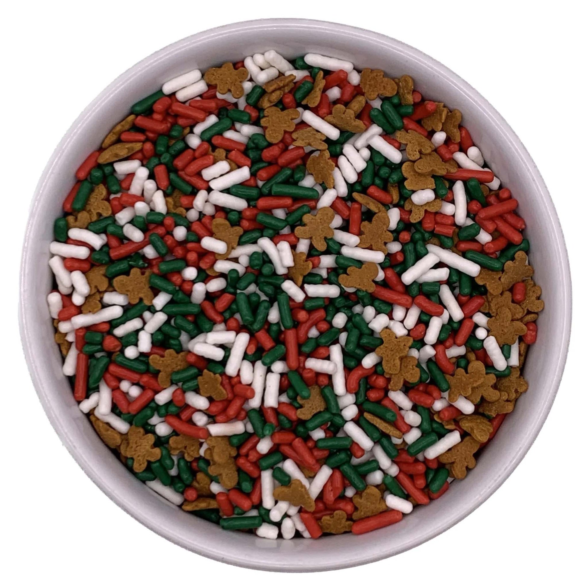 Bowl of red, green, and white jimmies sprinkle mix with gingerbread men shapes on a white background.