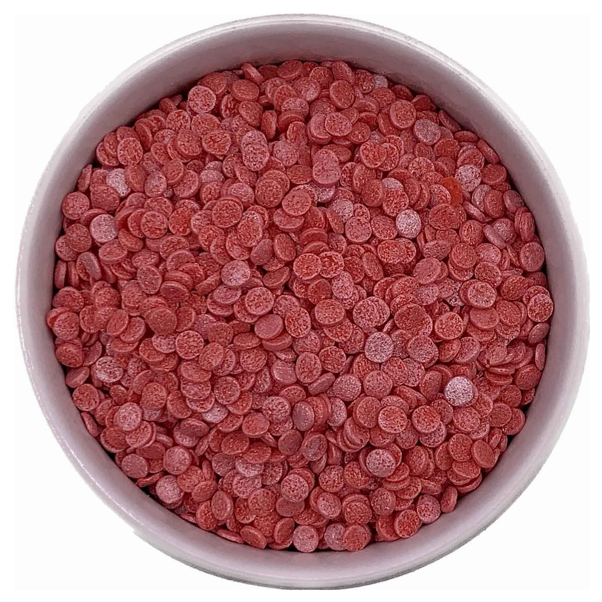 Red Pearlized Confetti Quinn Sprinkles in a white bowl, showing their small, flat, round shape and pearly finish