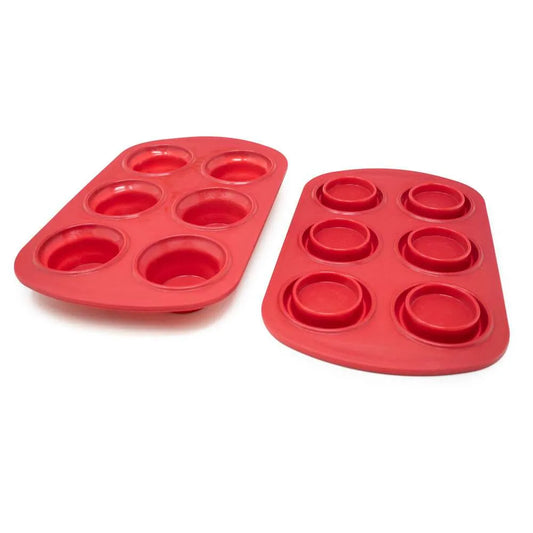 Two red silicone muffin pans with six cups each.