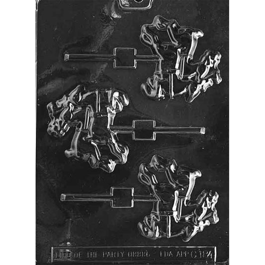 Clear plastic Reindeer Team chocolate lollipop mold showing three identical reindeer pair cavities with stick channels and raised harness details on a dark background.