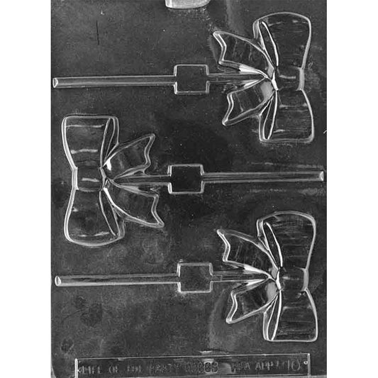Clear plastic chocolate lollipop mold with three ribbon bow cavities and stick channels, showing folded bow loops and ribbon tails.