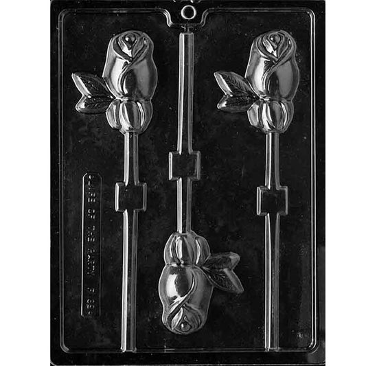 Clear plastic chocolate lollipop mold photographed on a black background with three rosebud-shaped cavities, each showing a rose blossom with leaf accents and a stick channel.