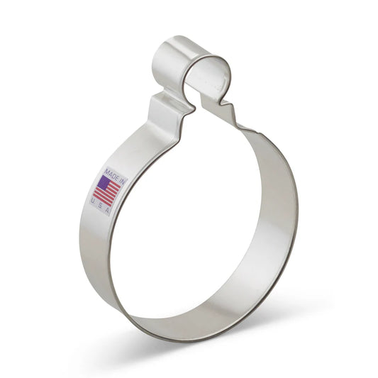 Metal round Christmas ornament cookie cutter with a looped top, featuring a 'Made in USA' sticker.