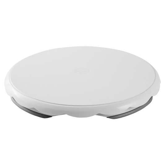 White 12-inch round plastic cake turntable with a non-slip base, shown from side angle.