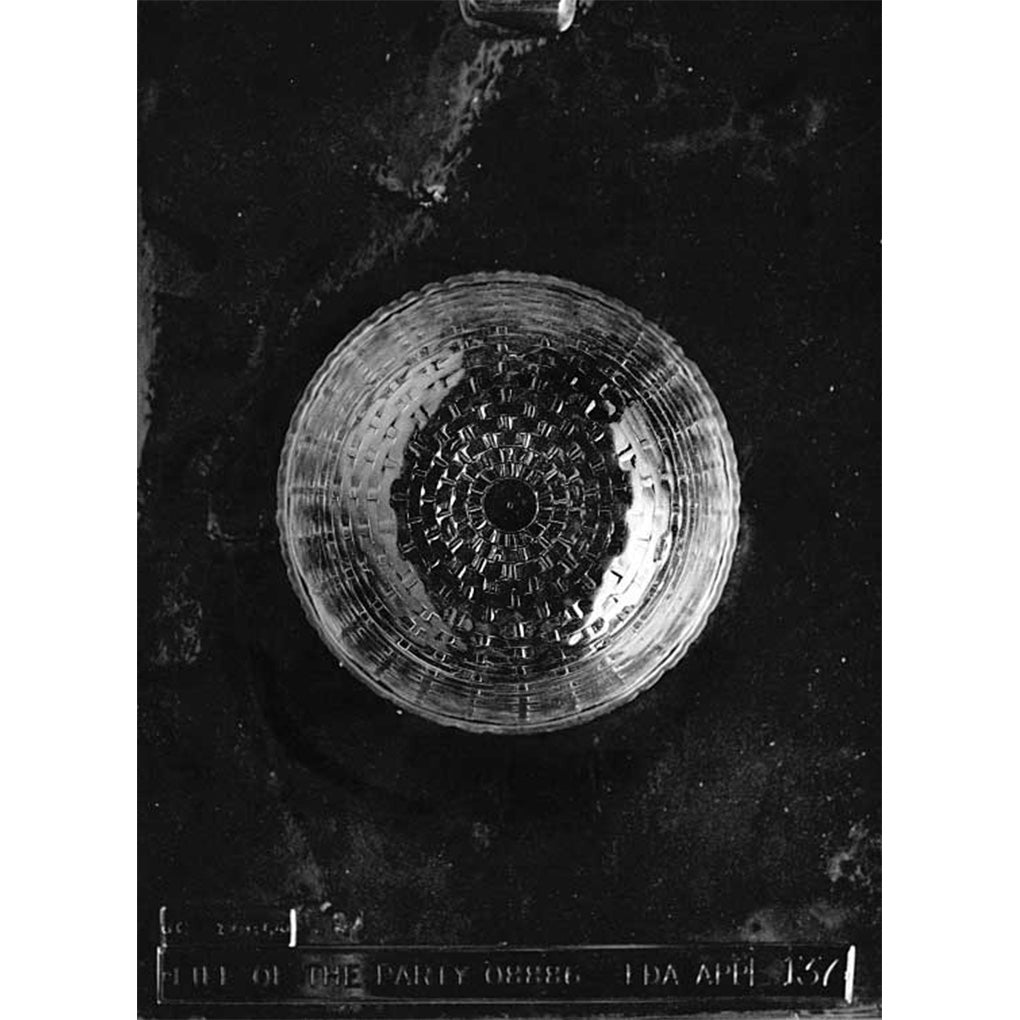 Clear round wicker basket chocolate mold on dark background, showing a single woven-texture bowl cavity with curved bottom for edible chocolate baskets.