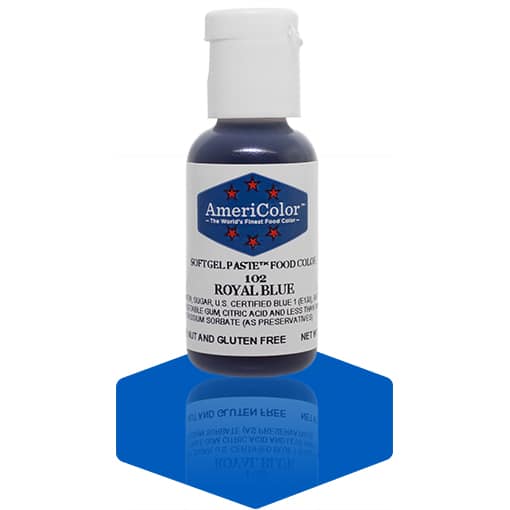 A bottle of AmeriColor Royal Blue soft gel paste food coloring, showcasing a white cap and blue label with red stars, placed on a shiny blue surface that reflects the bottle.