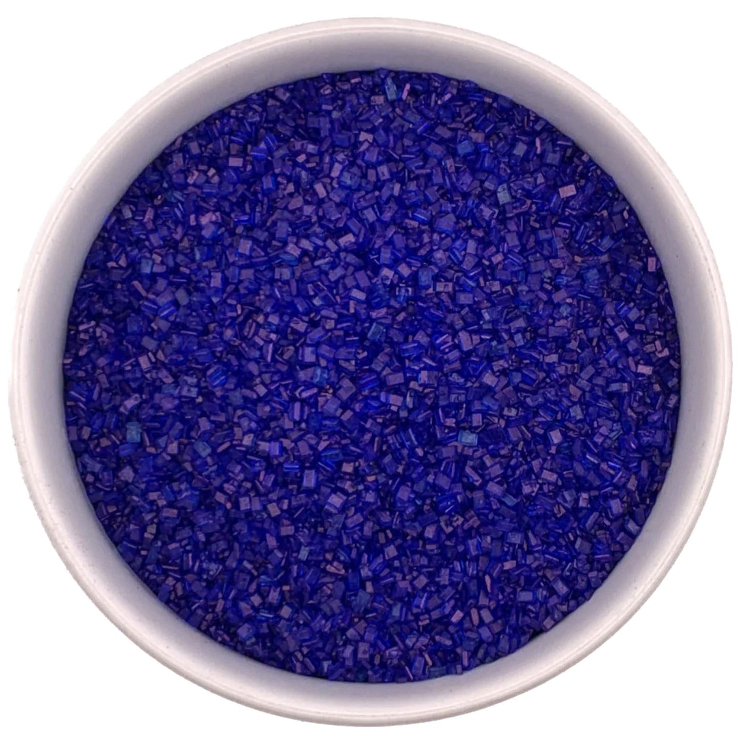 Top-down view of a white bowl filled with royal blue coarse sanding sugar crystals, showing chunky sparkling granules in a deep vivid blue color.