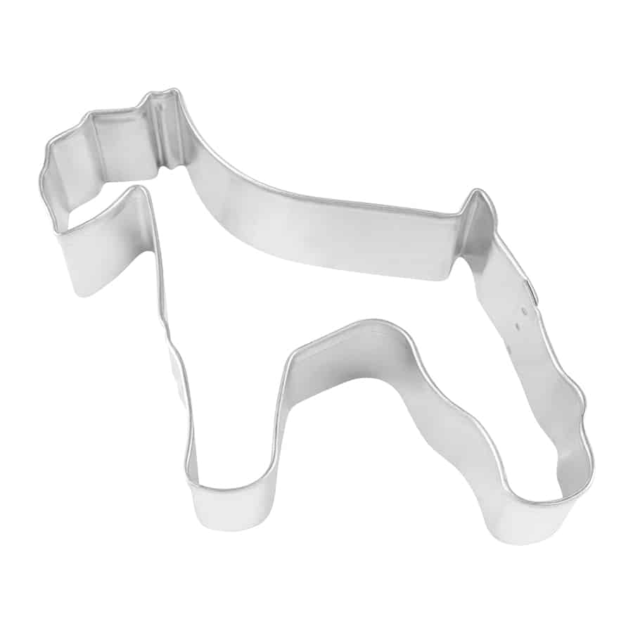 Overhead view of a metal Schnauzer-shaped cookie cutter with a defined silhouette, including the breed’s signature ears and stance.