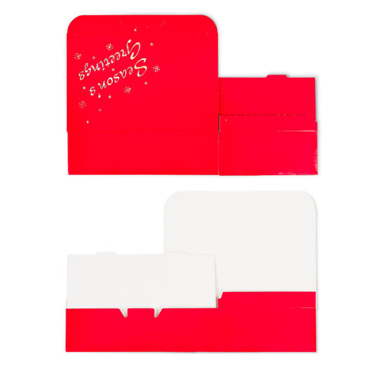 Unassembled red Season’s Greetings candy box shown flat with white interior panels, featuring the Season’s Greetings text and small snowflake accents on the lid section.