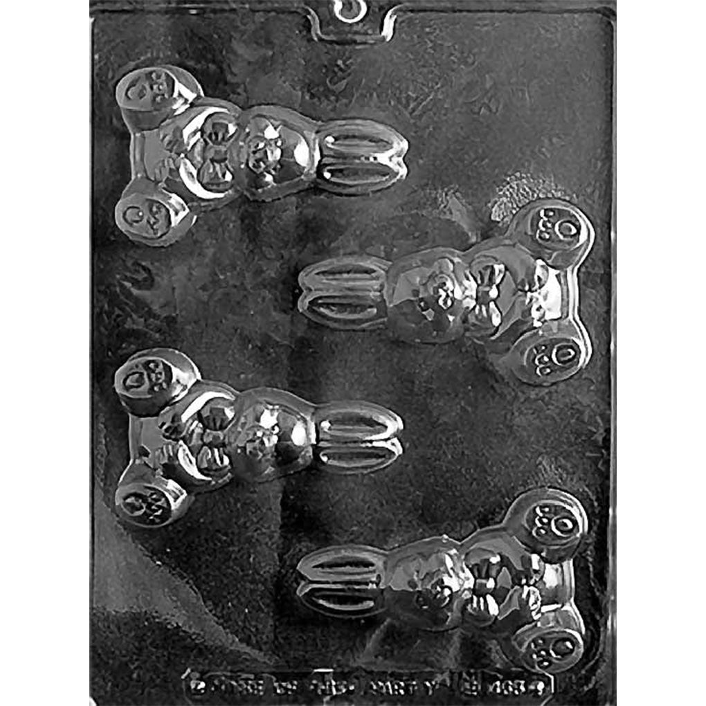 Clear Seated Easter Bunny Chocolate Mold photographed against a black background with 4 detailed seated bunny cavities featuring long ears and Easter-themed details.