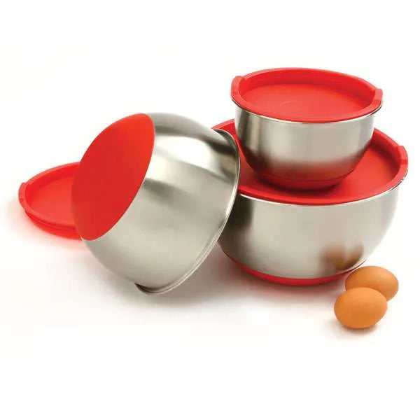 Three stainless steel mixing bowls with red lids, shown with one bowl tilted to display its non-slip red base.