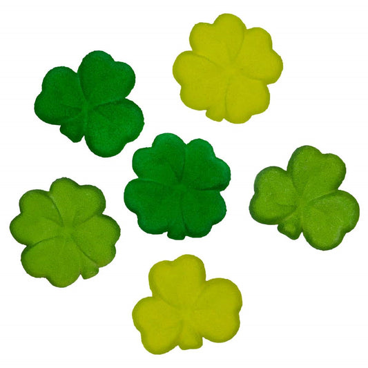Six shamrock pressed sugar decorations in assorted green shades on a white background, showing both three-leaf and four-leaf clover shapes.