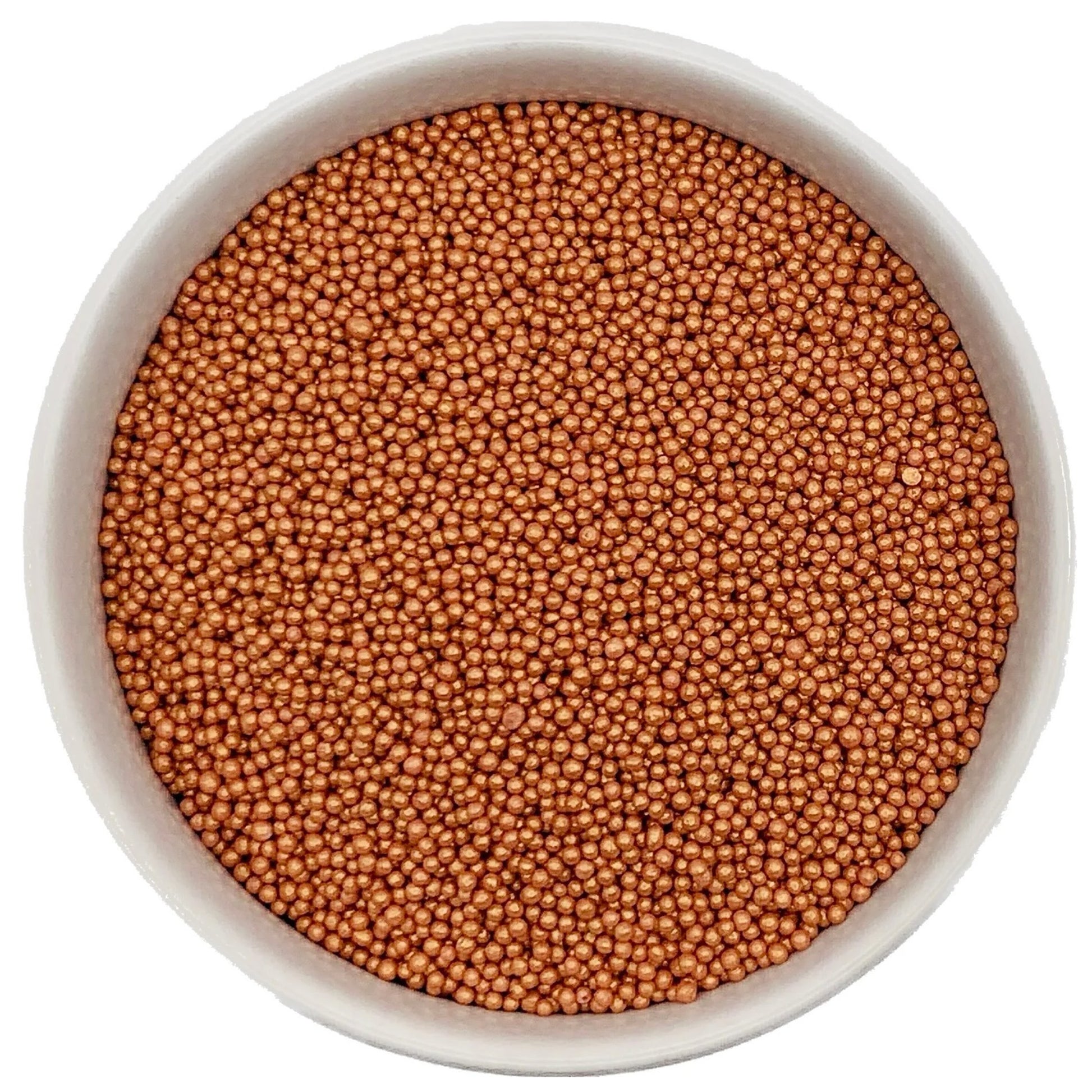 Top-down view of a white bowl filled with shimmer rose gold non-pareils, showing tiny round metallic sprinkle beads in a warm pink-gold shade.