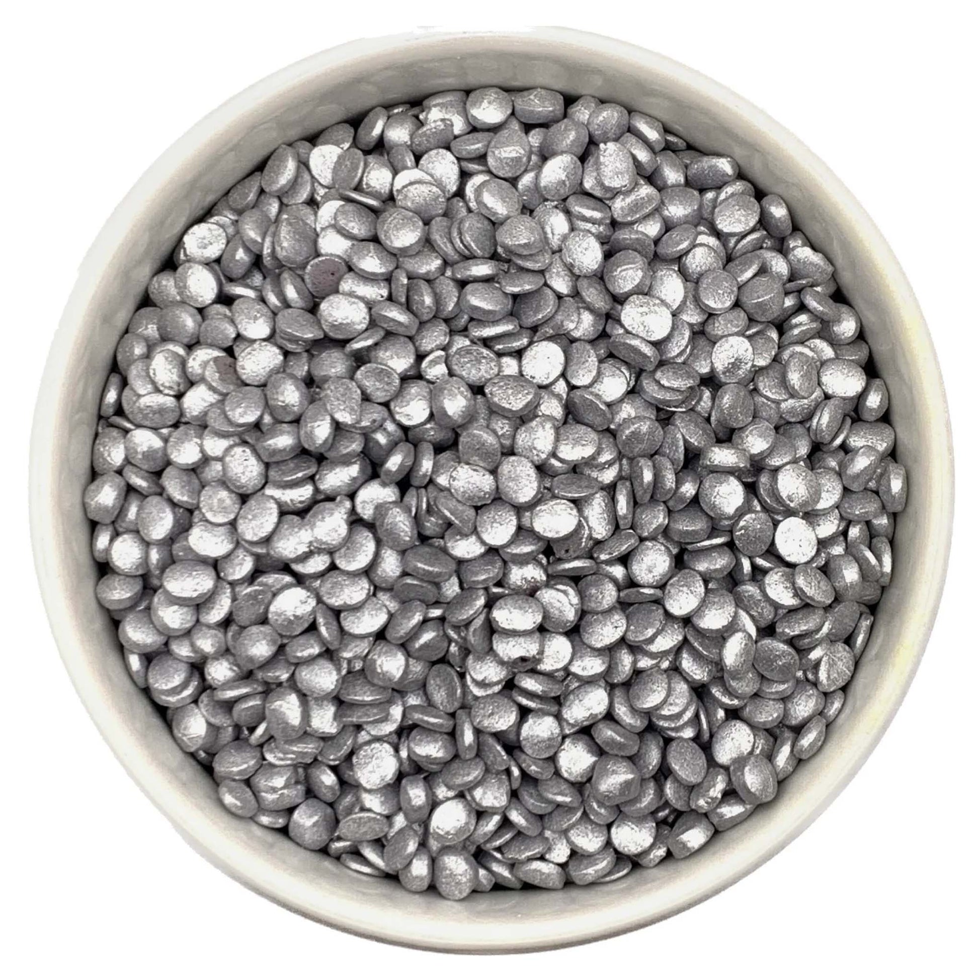 Metallic silver edible quins sprinkles in a white bowl, shown in a confetti shape, ideal for decorating cakes, cupcakes, cookies, and party desserts