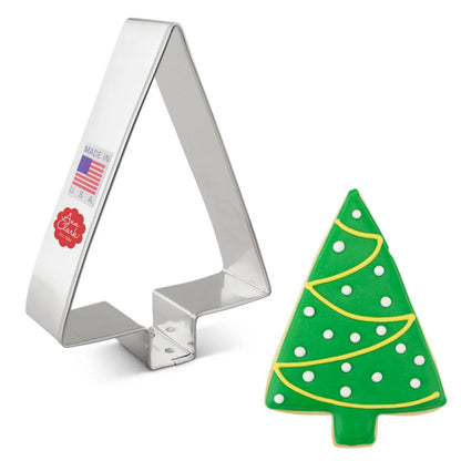 Simple Tree cookie cutter next to a decorated Christmas tree cookie with green icing, white polka dots, and yellow piping.