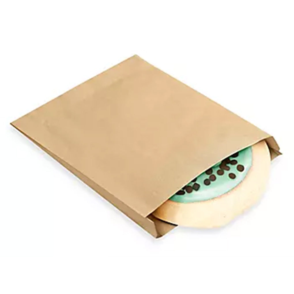 Kraft paper single-serve cookie bag with a round iced cookie partially visible inside, shown on a white background.