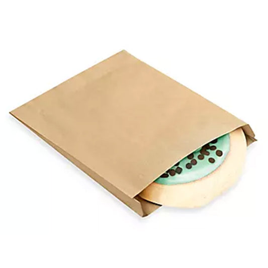 Kraft paper single-serve cookie bag with a round iced cookie partially visible inside, shown on a white background.