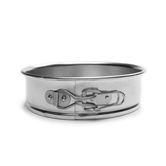 Empty 6-inch springform pan with latch mechanism visible on the side, ideal for baking and easy cake release.