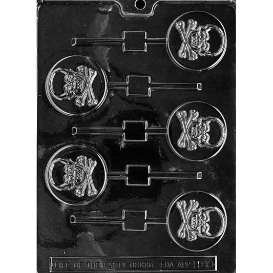 Clear chocolate lollipop mold with six round cavities featuring a raised skull and crossbones design on a dark background.