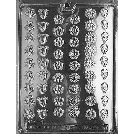 Plastic chocolate mold with rows of small assorted flower-shaped cavities in a variety of floral designs.