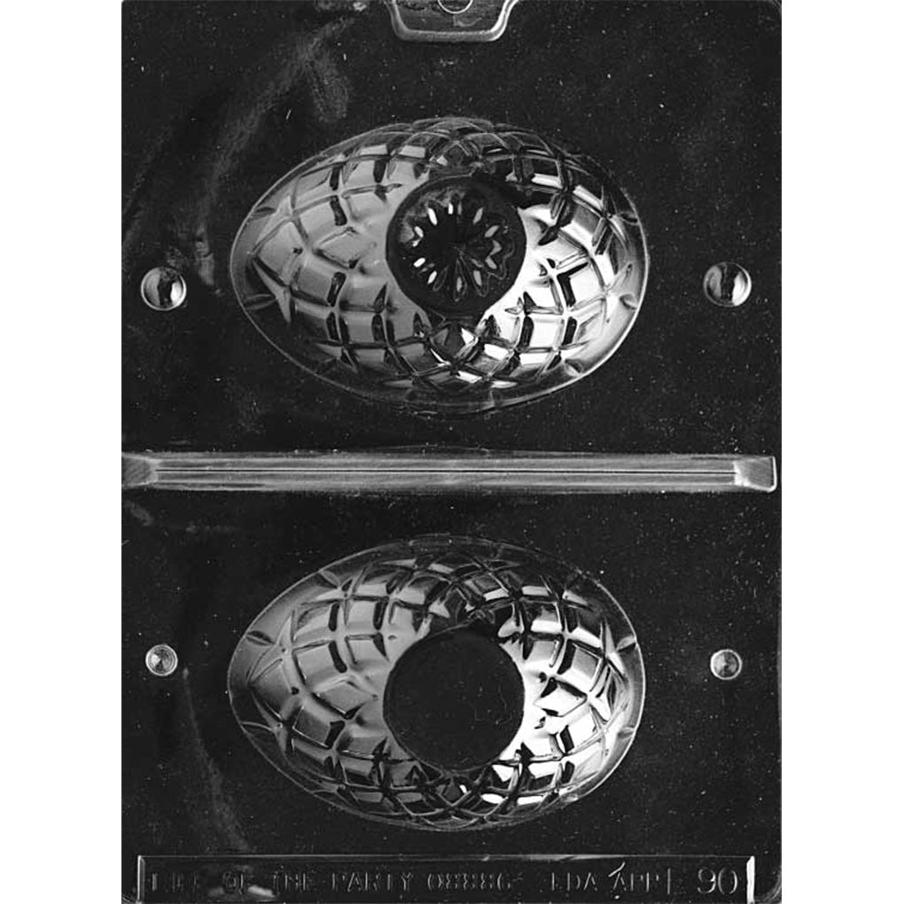 Clear plastic small cut crystal egg 3D chocolate mold sheet with two faceted egg half cavities and a center line designed for cutting to form top and bottom pieces.
