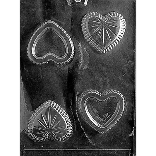 Clear plastic chocolate mold for a small heart-shaped pour box with four cavities, including matching heart box bottoms and decorative heart lids with scalloped edges.