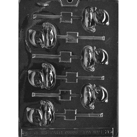 Clear plastic chocolate lollipop mold with multiple small duck-shaped cavities, showing raised duckling details and built-in stick slots on a dark background.