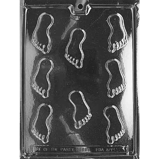 Clear Small Feet Chocolate Mold photographed against a black background with 8 small foot-shaped cavities featuring detailed toes.