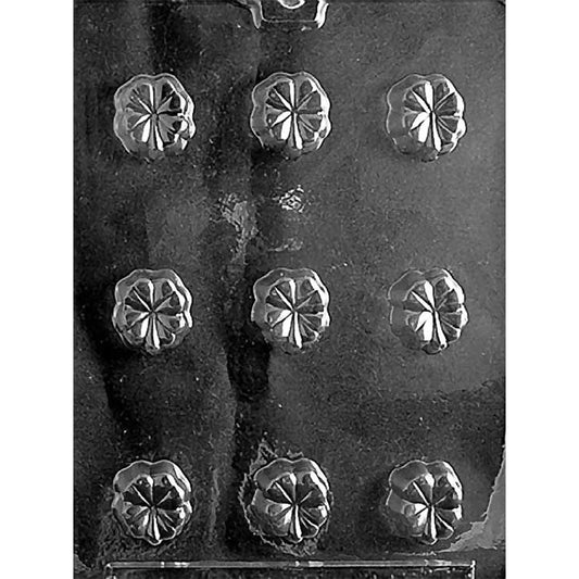 Close-up of a bite-sized four-leaf clover chocolate mold with nine small clover cavities, each with raised petal detail, shown in clear plastic.