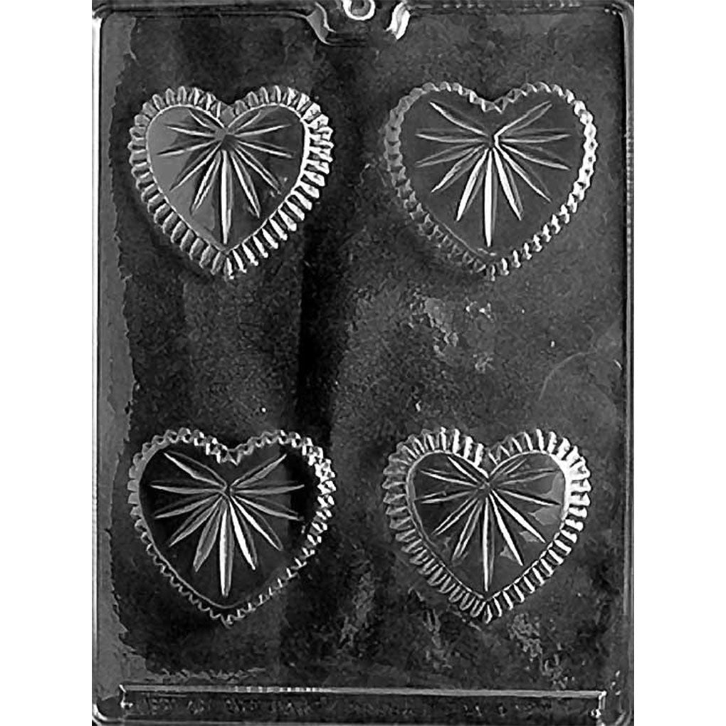 Clear Small Heart Candy Dish Chocolate Mold photographed against a black background with four cut-glass-style heart cavities for two assembled dishes