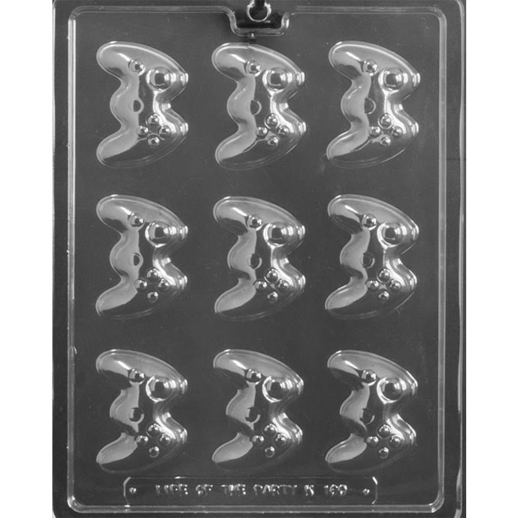 Clear Small Video Game Controllers Chocolate Mold photographed against a black background with 9 controller-shaped cavities featuring raised joysticks, buttons, and curved grips.