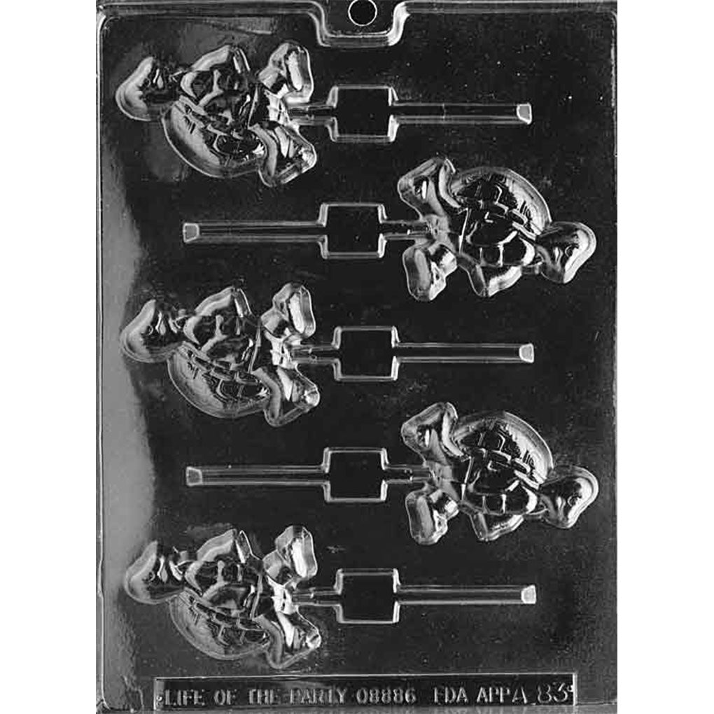 Clear plastic chocolate lollipop mold with six small walking turtle cavities, each showing a turtle body with textured shell and flippers, plus stick channels.