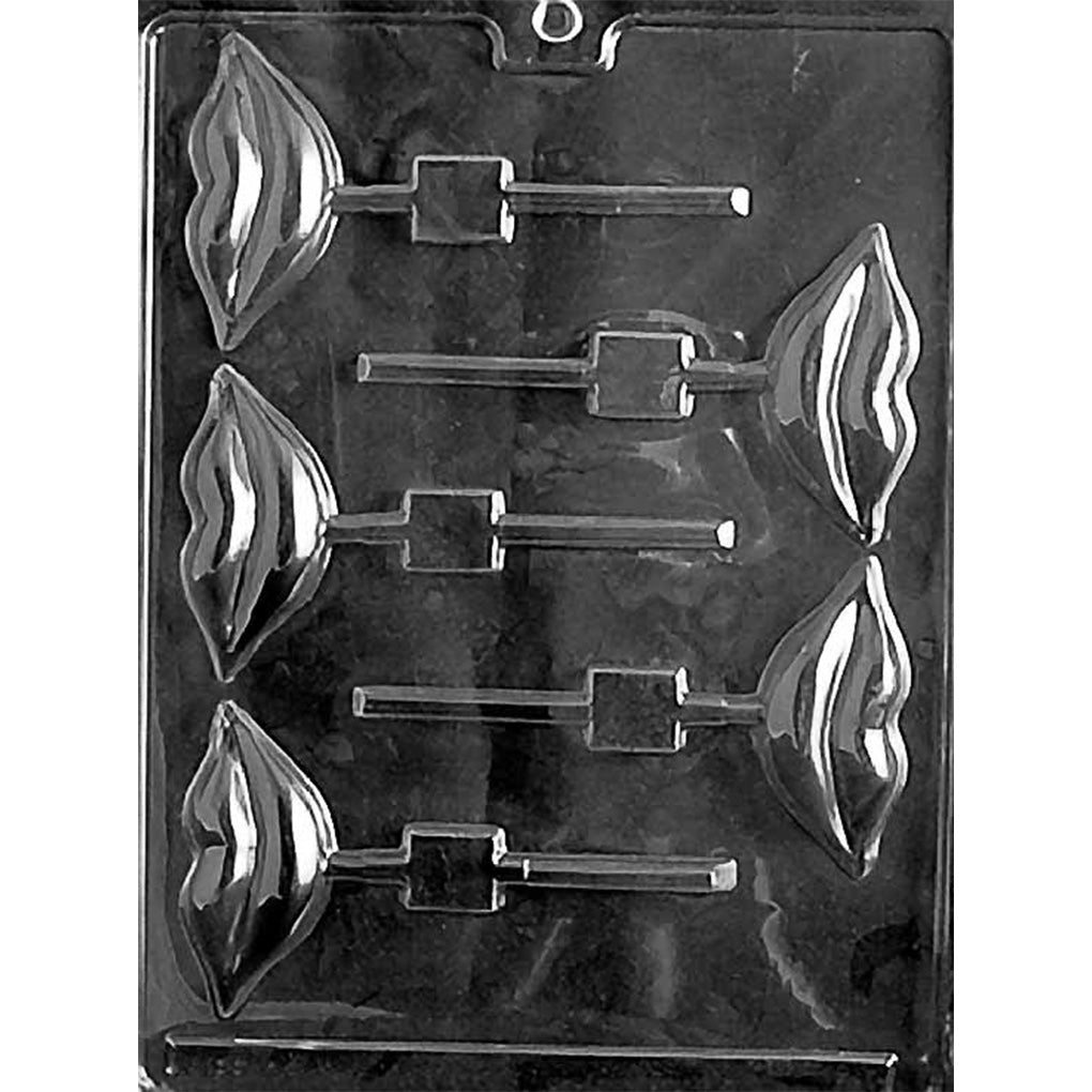 Clear plastic chocolate lollipop mold photographed on a black background, with six smiling lips cavities and stick channels for making lip-shaped chocolate pops.
