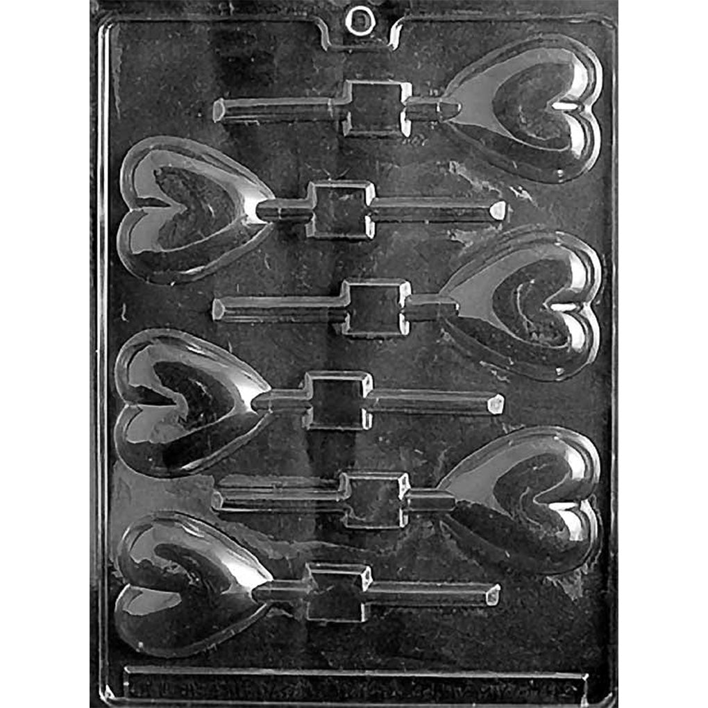Black plastic chocolate lollipop mold with six smooth heart-shaped cavities and stick channels, designed for making glossy heart chocolate pops.