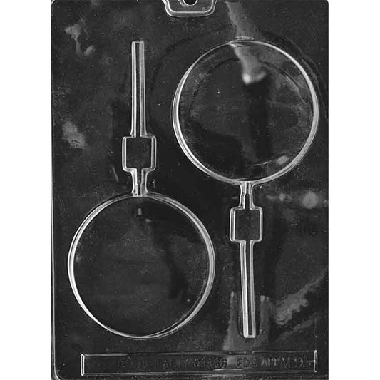 Clear plastic round chocolate lollipop mold with two smooth 3 1/2-inch cavities and built-in stick channels
