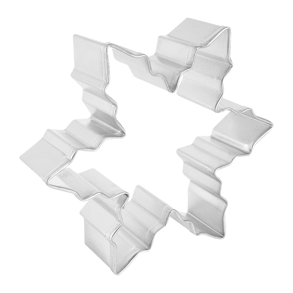 Angled side view of the snowflake cookie cutter, showcasing its depth and detailed shape.