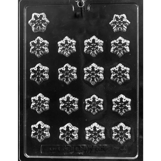 Clear plastic chocolate mold with multiple bite-sized snowflake cavities, each with detailed snowflake pattern