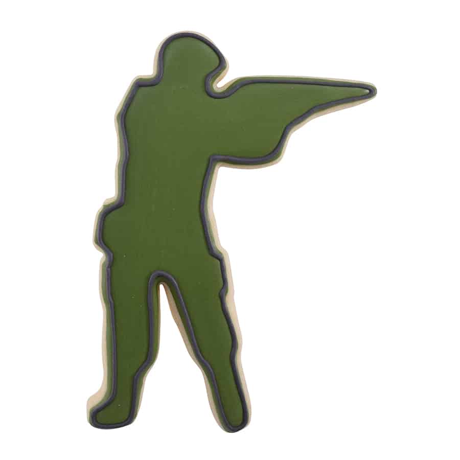 Decorated cookie shaped like a soldier or hunter, covered in green icing with black outline details.