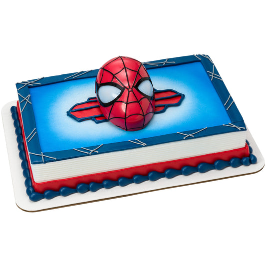 Spider-Man head cake topper displayed on a rectangular blue and red decorated cake.