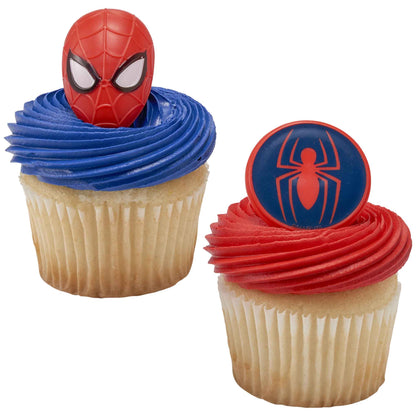 Two cupcakes with blue and red frosting topped with Spider-Man mask and round spider symbol rings