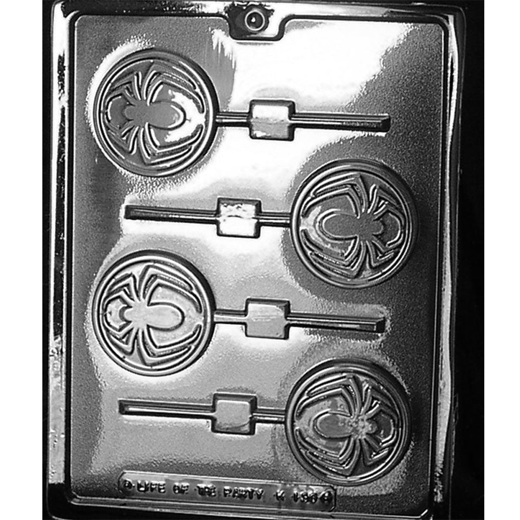 Chocolate lollipop mold with four round spider-symbol cavities and alternating horizontal stick channels.